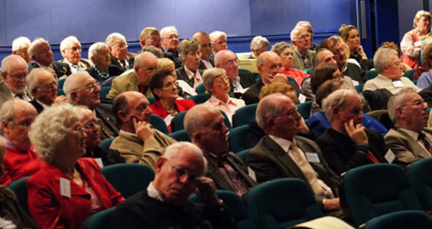 Older adults engaging in senior citizens' parliament event Ireland.