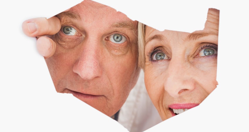 Close-up of senior citizens discussing at Irish Senior Citizens Parliament, emphasizing elder rights and community engagement.