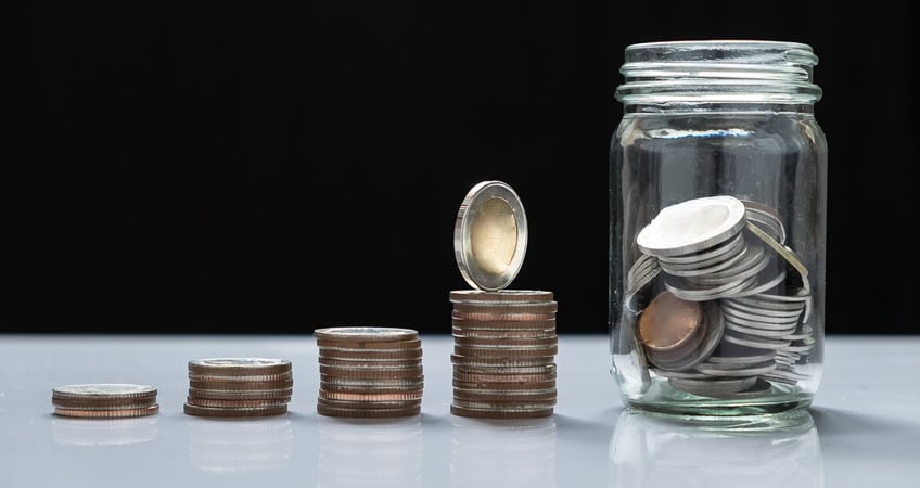 Image of stacked coins and jar of coins representing senior savings.