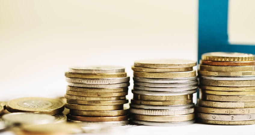 Coins representing financial support for Irish seniors and the importance of senior citizens' participation.