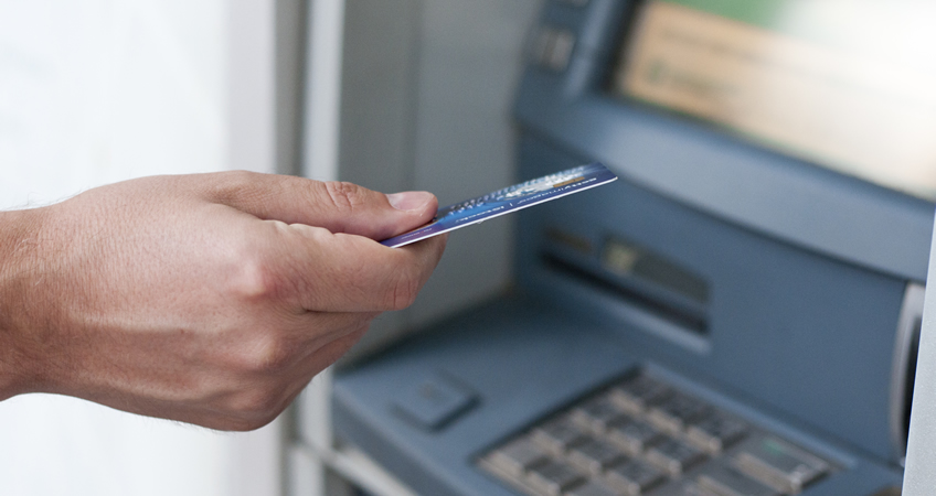 ATM withdrawal by senior citizen.