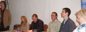 Irish Senior Citizens Parliament event with senior citizens discussing issues.
