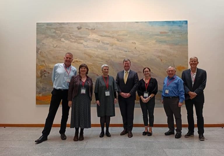 Group of senior citizens and leaders at Irish Senior Citizens Parliament event in Ireland.