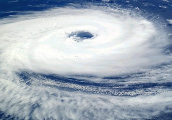 Severe storm system with dense cloud cover and powerful winds.